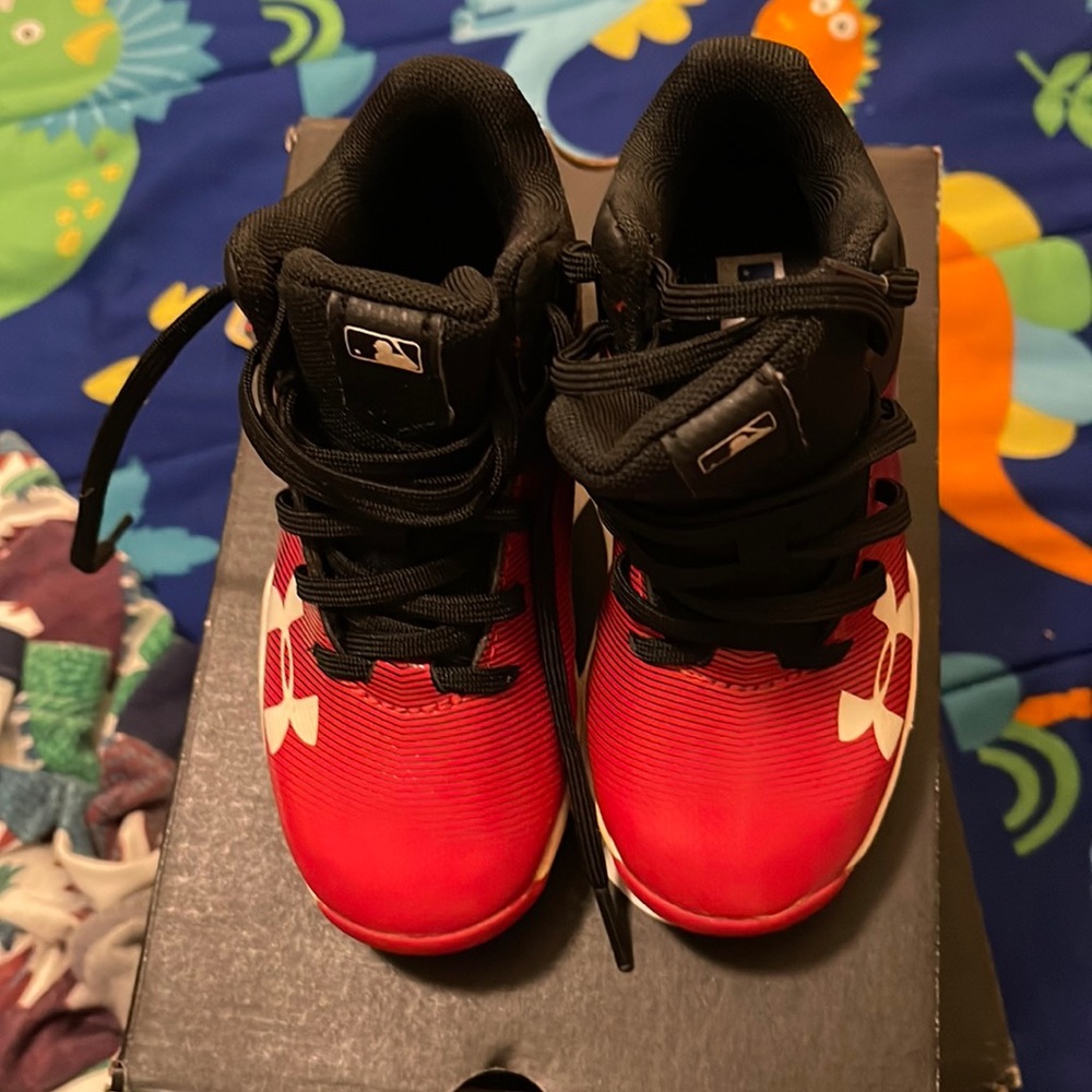 Need cleats for baseball season! Red And Black Under Armour Clears size 9
